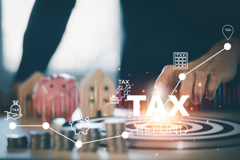 Concept of tax payment optimisation business finance,Man using calculator and taxes icon on technology screen,income tax and property, background for business, individuals and corporations such as VAT